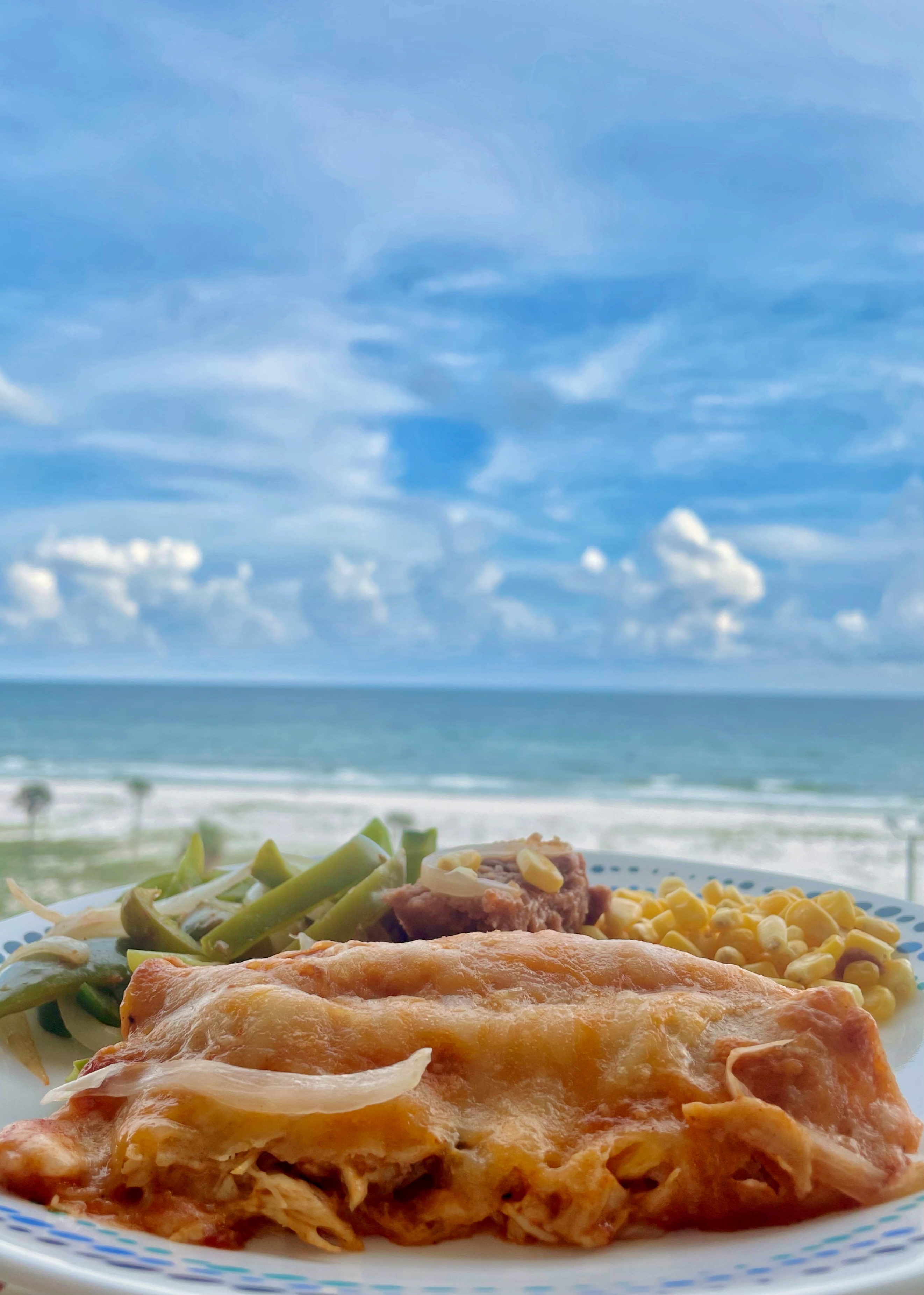 Mexican Enchiladas Refried Beans Green Peppers Onions Gulf of Mexico Beach Ocean Background